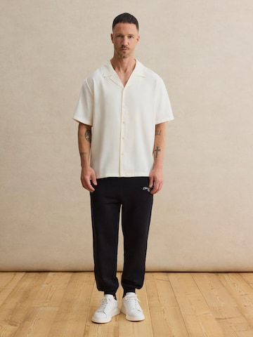 DAN FOX APPAREL Tapered Housut 'Matti' värissä musta
