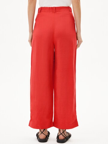 ARMEDANGELS Loose fit Trousers in Orange