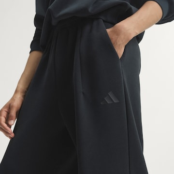 ADIDAS SPORTSWEAR - Loosefit Calças de desporto em preto