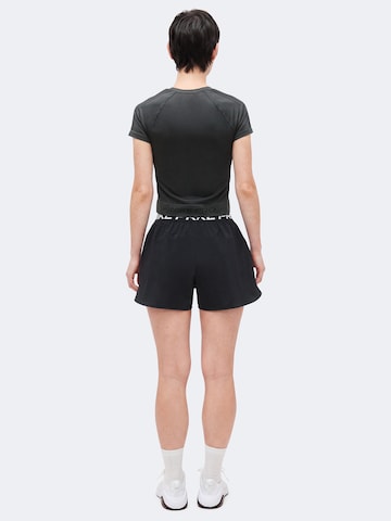 NIKE Loosefit Sporthose 'NP' in Schwarz