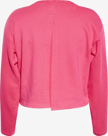 Sweat-shirt swirly en rose