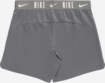 NIKE Skinny Workout Pants 'Trophy' in Grey