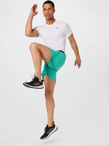 Slimfit Pantaloni sportivi di Reebok in blu