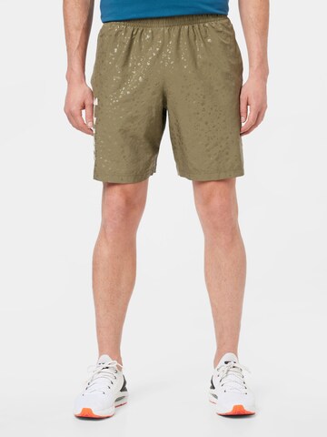 UNDER ARMOUR Regular Sports trousers in Green: front