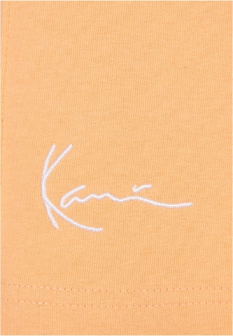 Karl Kani - regular Pantalón en naranja