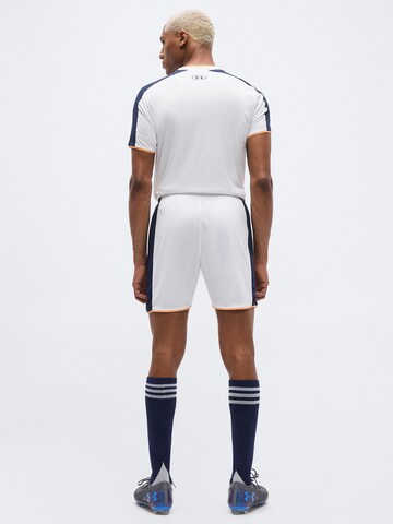 balta UNDER ARMOUR Standartinis Sportinės kelnės 'Challenger'