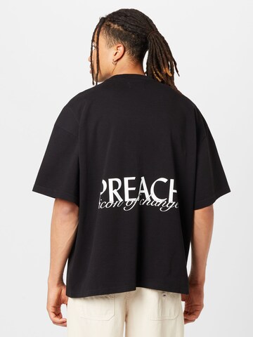 Tricou de la Preach pe negru