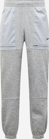 NIKE Sports trousers in Grey: front