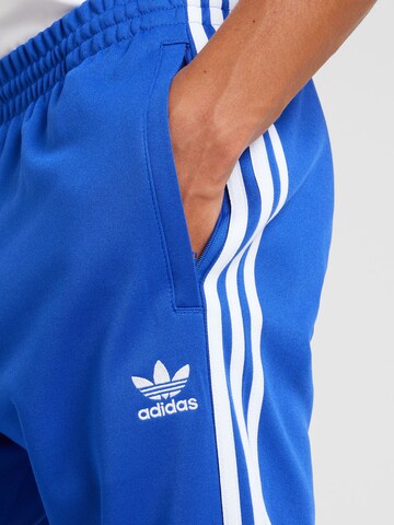 ADIDAS ORIGINALS Дънки Tapered Leg Панталон 'Adicolor Classics Sst' в синьо