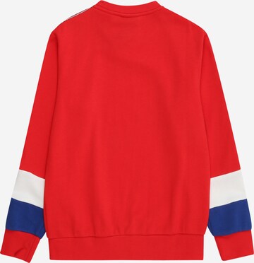 Felpa di Champion Authentic Athletic Apparel in rosso