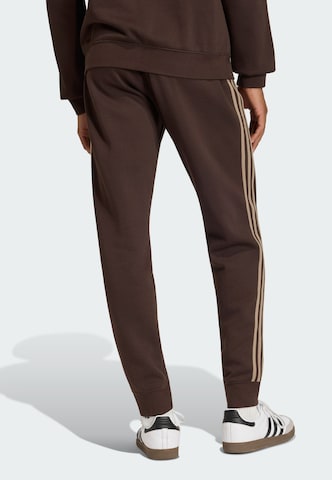 Effilé Pantalon ADIDAS ORIGINALS en marron