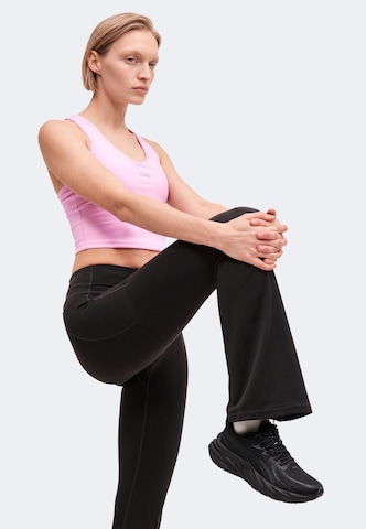 Evazați Pantaloni sport 'Luxe' de la ICANIWILL pe negru