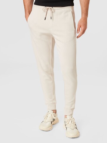 Calvin Klein Tapered Nadrág - bézs: elől