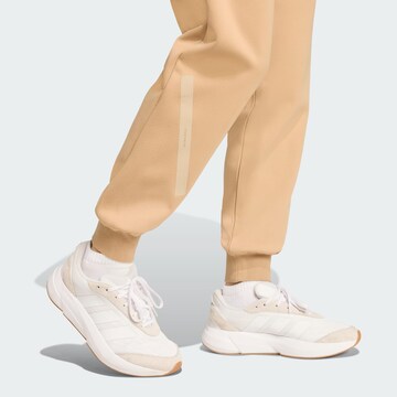 ADIDAS SPORTSWEAR - Tapered Calças de desporto 'Z.N.E.' em bege