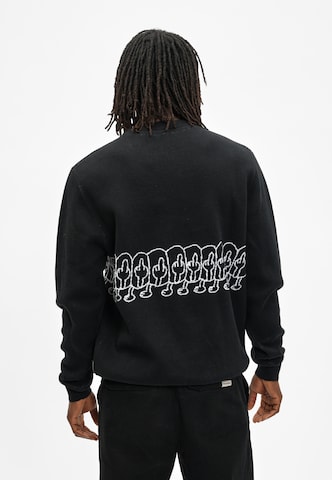 Cleptomanicx Sweater 'FUHUMANS' in Black