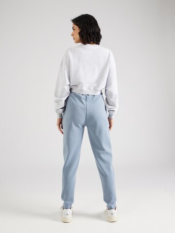 Athlecia Tapered Sporthose in Blau