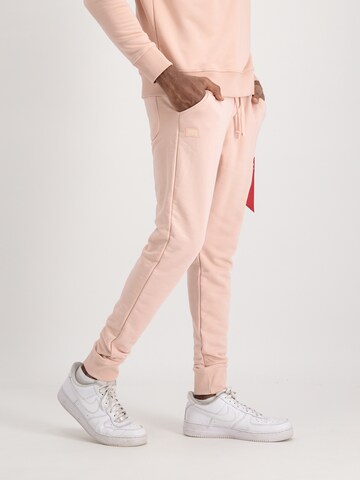 ALPHA INDUSTRIES Tapered Trousers 'X-Fit' in Orange