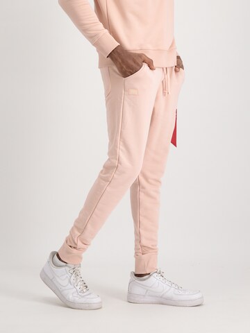 ALPHA INDUSTRIES Tapered Pants 'X-Fit' in Orange