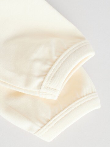 Set Next en beige