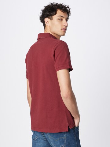 LEVI'S ® T-shirt 'Housemark Polo' i röd