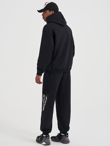 Effilé Pantalon AND1 en noir