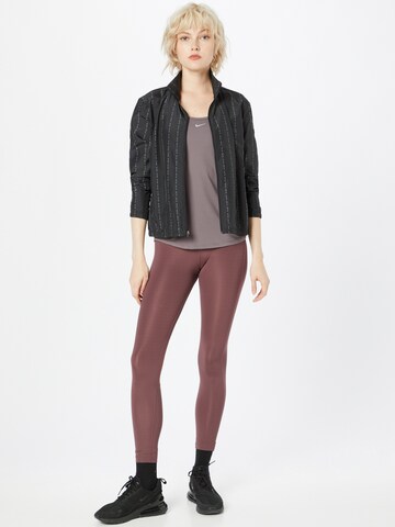 Skinny Pantalon de sport NIKE en rouge