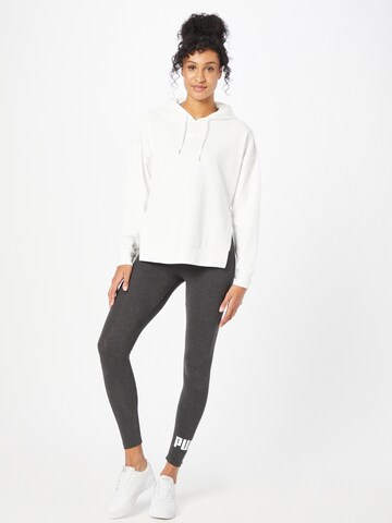 PUMA - Skinny Pantalón deportivo 'Essentials' en gris