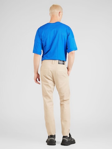 smėlio Calvin Klein Jeans Standartinis „Chino“ stiliaus kelnės