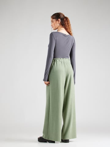 ABOUT YOU Loose fit Trousers 'Fotini' in Green
