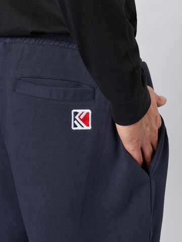 Effilé Pantalon 'Signature' Karl Kani en bleu