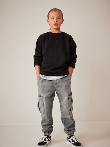 Tapered Jeans di Next in grigio