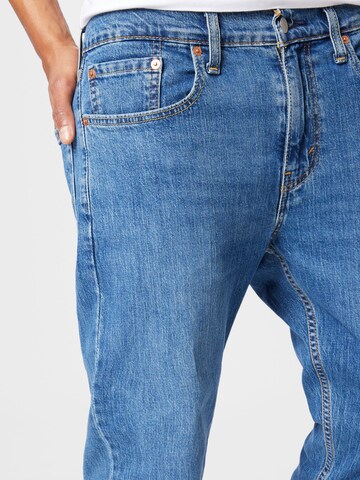 LEVI'S ® Avsmalnet Jeans '502™ Taper Hi Ball' i blå