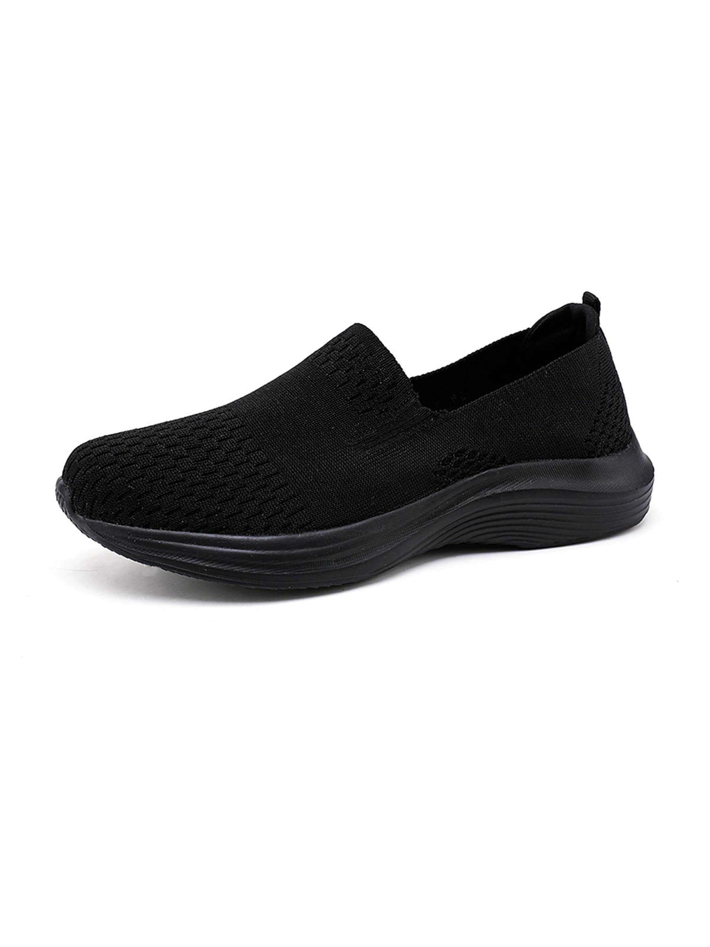 HUSKSWARE Slip-Ons in Black: front