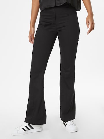 Monki Flared Pleated Pants in Black: front