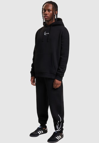 Tuta da jogging di Karl Kani in nero: frontale