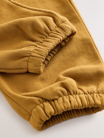Next Tapered Housut värissä keltainen