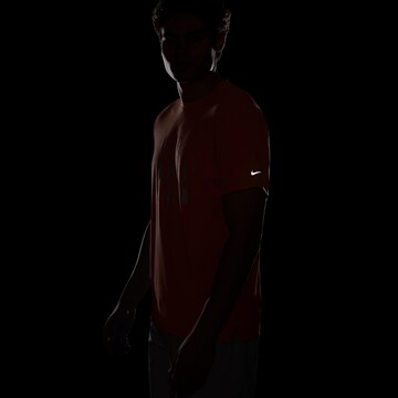 NIKE Funktionsshirt 'Rise 365' in Orange