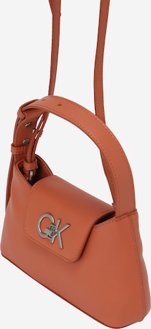 Calvin Klein - Bolso de mano en naranja: frente