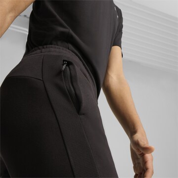 PUMA Tapered Sporthose 'Evostripe' in Schwarz