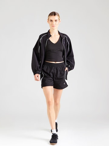 PUMA Sporttop in Schwarz