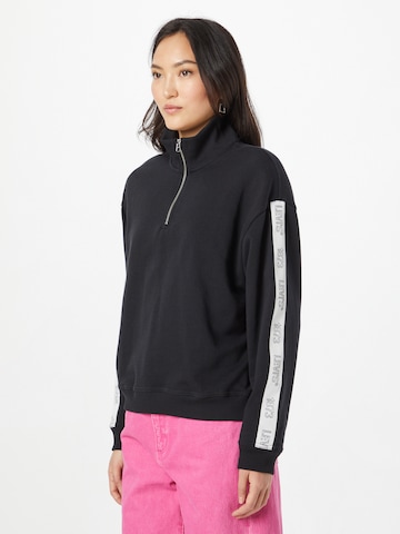 LEVI'S ® Sweatshirt 'Graphic Rue 1/4 Zip Crew' i svart: framsida