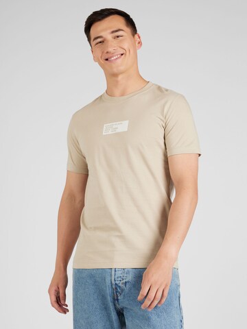 T-Shirt Calvin Klein Jeans en beige : devant