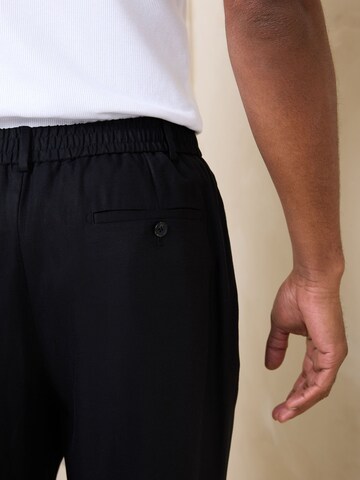 Loosefit Pantaloni con pieghe 'N. Premium' di Next in nero