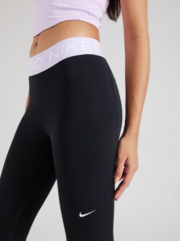 NIKE Skinny Športne hlače 'NP 365' | črna barva