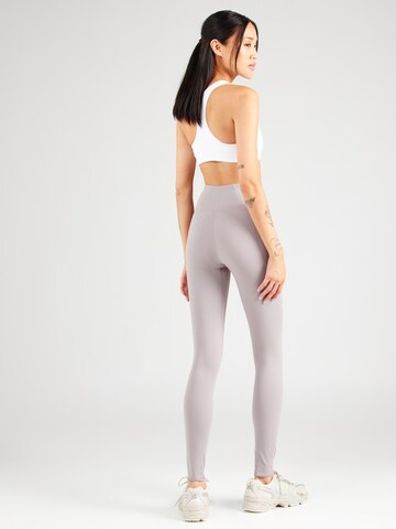 UNDER ARMOUR Skinny Sporthose 'Motion EMEA' in Grau