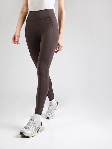Girlfriend Collective Skinny Workout Pants in Brown: front