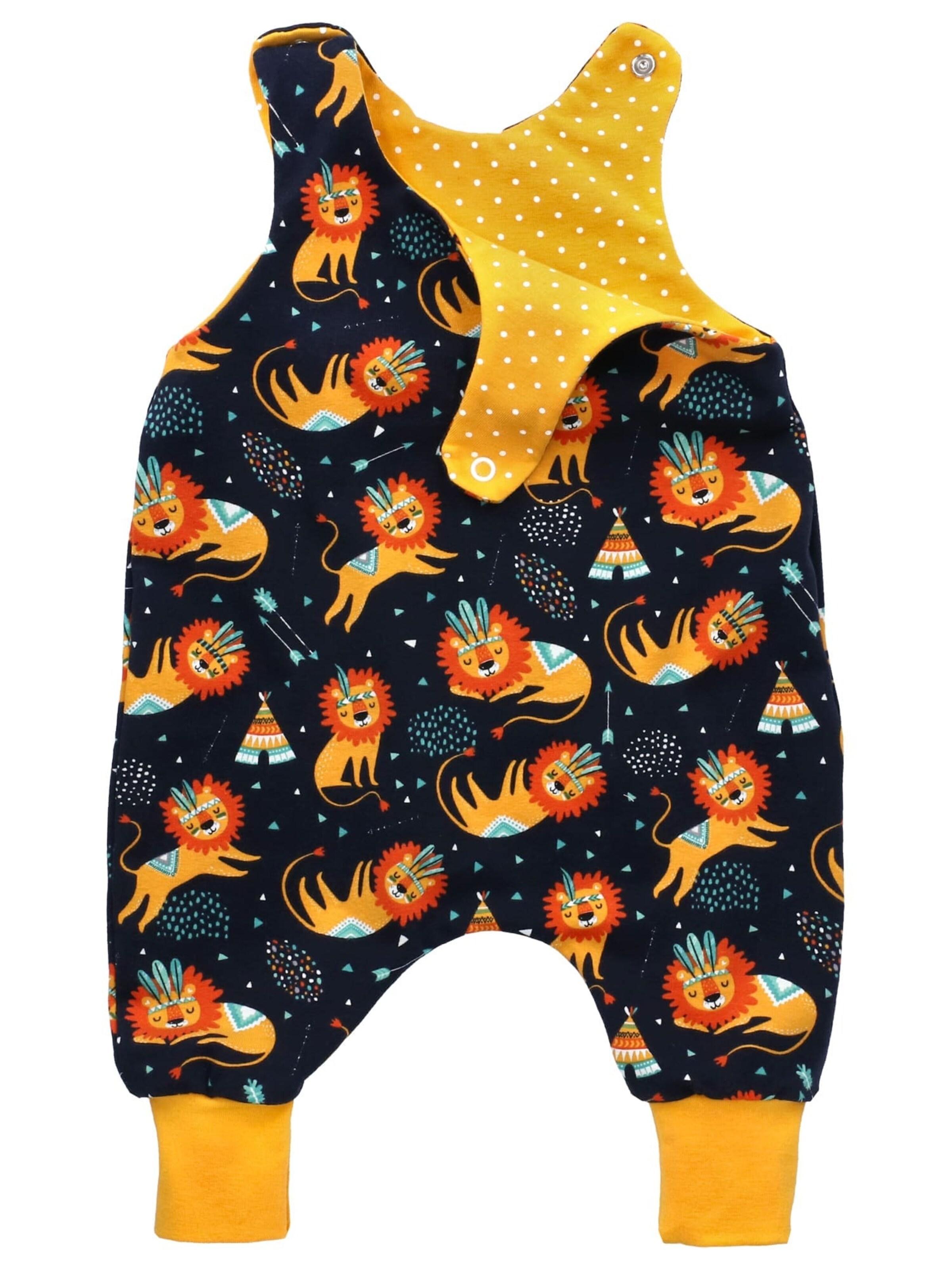 Land-Juwelen Rompertje/body 'Handmade Löwe' in Geel