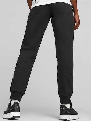 regular Pantaloni sportivi 'Puma Logo Printed Elastic Waist Active Joggers' di PUMA in nero