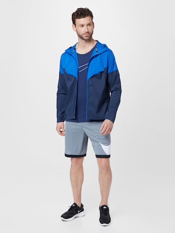 Veste de sport NIKE en bleu