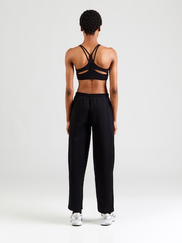 UNDER ARMOUR Regular Workout Pants in Black